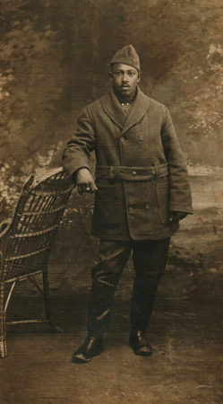 Unknown Black man, possibly in military uniform and coat