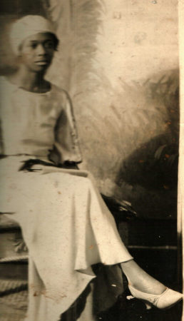 Unknown Black woman sitting and posing