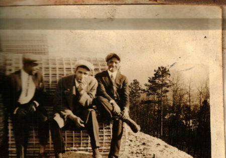 Black men smoking and laughing