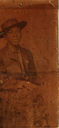 Black man with hat posing
